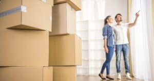 couple moving into new home with boxes