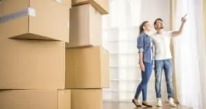 couple moving into new home with boxes