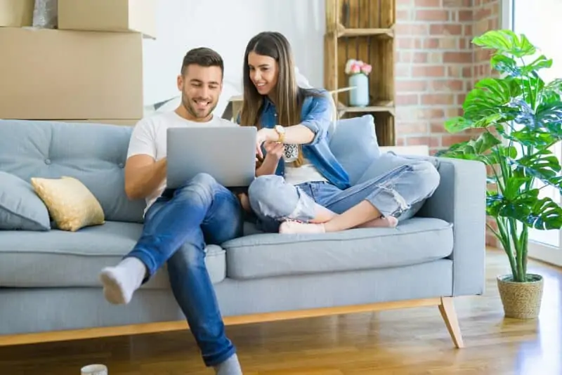Couple on couch with laptop