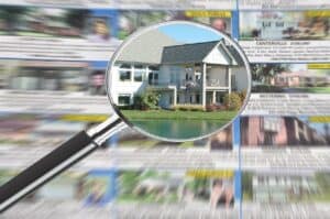 magnifying glass over newspaper debunking real estate myths